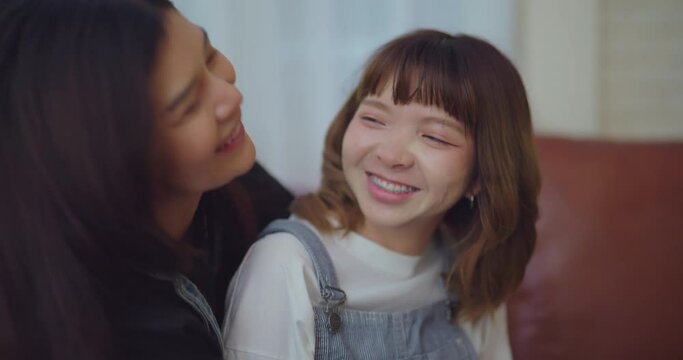 Happiness moment, Young lesbian couple with happy expression in bedroom at home. They enjoying together with this moment.