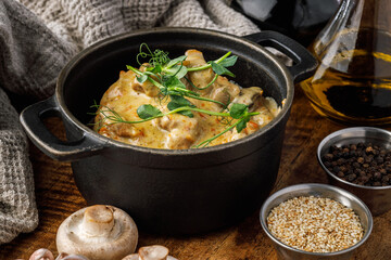 Chicken Stroganoff with mushrooms and sauce in a casserole