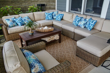 Coastal-Inspired Patio Decor with Wicker Furniture and Blue Accents