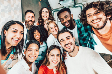 Multiracial friends taking group selfie shot at camera - Happy young people smiling together at...