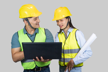 Asian Couple Engineer & Architect gives gestures and expressions on construction field with laptop