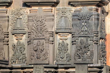 Ornate carvings of a Hindu deities at the ancient Hoysala era Chennakeshava temple in Belur, Karnataka.