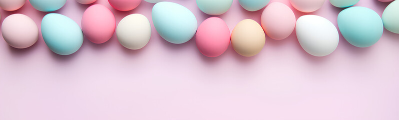 Flat lay of colored Easter eggs. Plain pastel background.