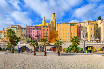 View from the Plage des Sablettes beach and promenade of the colorful old town of Menton, France,...