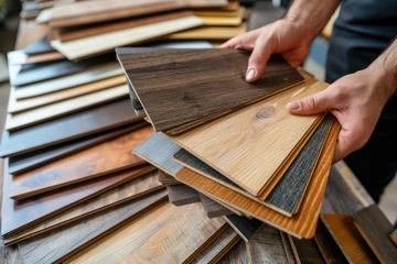 Deurstickers Man selecting laminate wood samples in a hardware store © NikoG