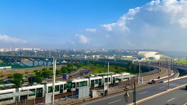 4K video of Modern tram passing by the Bou Regreg river and Scenic view of old city of oudaya with a view over the Grand Theatre of the capital city of Morocco, RABAT