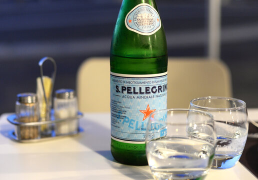 LERICI, ITALY &ndash; SEPTEMBER 26, 2023: selective focus on bottle of San Pellegrino, Italian mineral water based in Bergamo, currently produced by Nestle. 