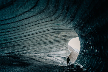 Rounded tunnel ice cave view from the inside. Cueva de Jimbo, Ushuaia, Tierra del Fuego