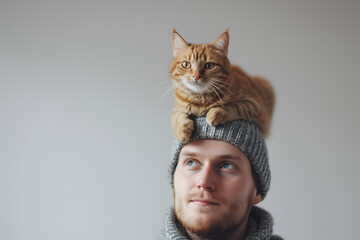 Fluffy ginger cat sits on a man's head. Minimalistic pets style isolated over light background