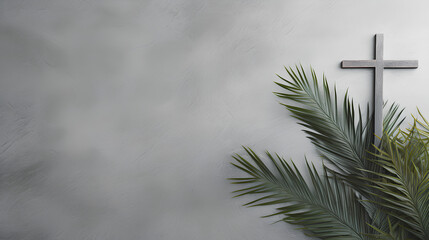 Christian cross and green palm leaf. Gray background. Holy week. Palm Sunday. - obrazy, fototapety, plakaty