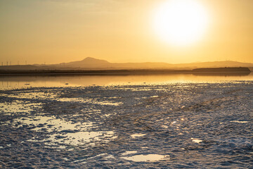 Larnaca salt lake in Cyprus. Lake dries up and the ground is covered with a layer of white salt 