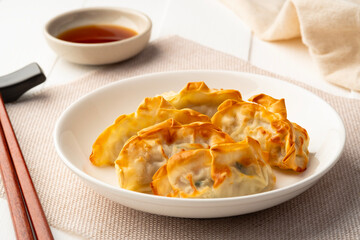 Airfryer gyoza,Use Air Fryer grilled dumplings pork and vegetables on white plate