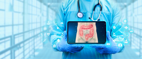 The doctor projects the human large intestine on the tablet. Study and analysis of colon cancer,...