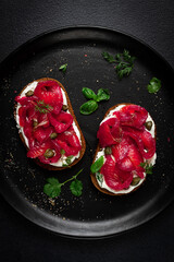 Sandwiches with gravlax salmon, cream cheese, capers, greens, breakfast, homemade,