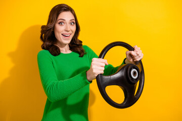 Photo of cheerful glad girl wear stylish green clothes driving fast car weekend trip isolated on...
