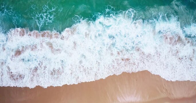 Top-view Beach sea wave rolling come in sandy beach