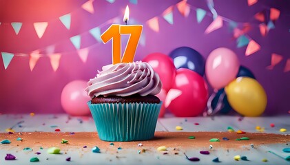 Birthday cupcake with burning lit candle with number 17. Number seventeen for seventeen years or seventeenth anniversary.