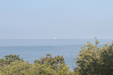 Big ship arriving to santa marta city port viewed from a viewpoint