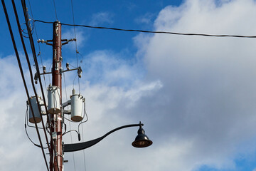 Light pole on blue and cloudy  sky background
