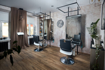 Barber shop or barbershop vintage design hair man salon empty with two chairs and two mirrors and accessories.