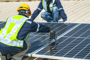 engineer men inspects construction of solar cell panel or photovoltaic cell at roof top. Industrial...