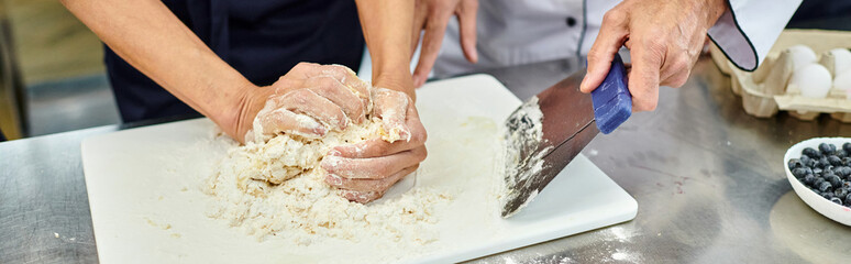 cropped view of woman working with dough with chief cook helping her, confectionary, banner