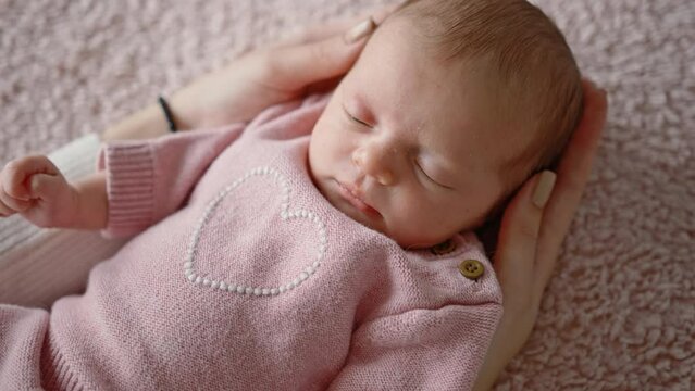 Solicitous Mother Gently Stroking And Puts To Bed Her Cute Infant Baby Girl