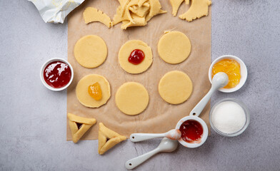 Dough, Jam, Sugar, Butter, Rolling Pin on Gray Stone Table. Purim Celebration, Jewish Carnival Holiday Concept.