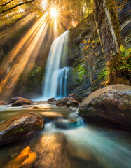 A waterfall time exposure with sun rays - 04