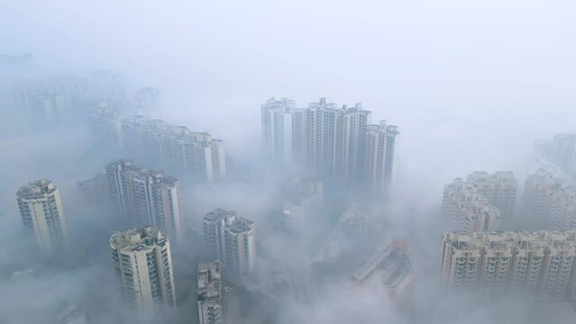 As winter descends upon Gurgaon, a mystical transformation unfolds with the arrival of dense fog, lending an otherworldly ambiance to the urban landscape. 