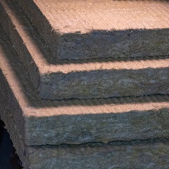 Stacked thermal insulation material, rock wool. Thermal roof insulation layer. Mineral wool or...