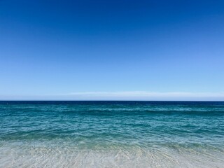 Pure blue sea horizon, blue seascape background, clear sky
