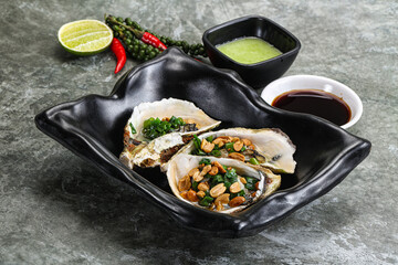Open half oysters with green onion