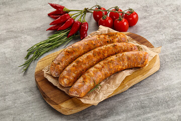 Raw sausages with spices and herbs
