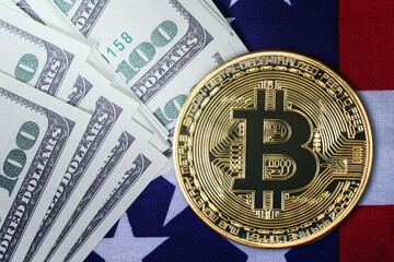 Close up Gold Bitcoin coin and banknote on usa flag