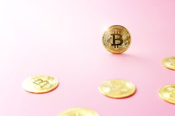 Close up golden bitcoin coin on pink background. Cryptocurrency symbol. The shiny bitcoin gold coin stands out among other coins with copy space.