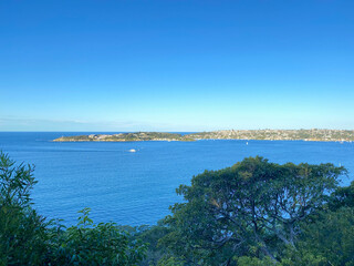 Coast of the ocean form a mountain-top. View of the city in the distance. Landscape and shore, Australia, NSW.