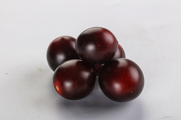 Raw ripe black kumato tomato