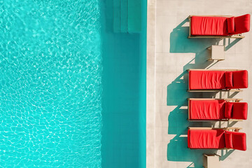 Red sun beads near the pool, no people, generative ai