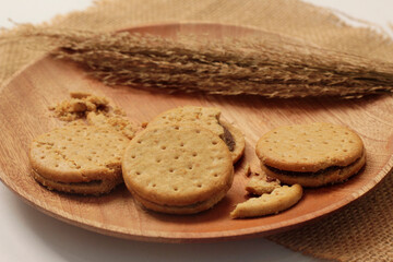 Chocolate sandwich cookies, baked biscuits filled with milk cream isolated on white background with clipping path, collection. Sandwich cookies, chocolate cream filled biscuits, full depth of field. 