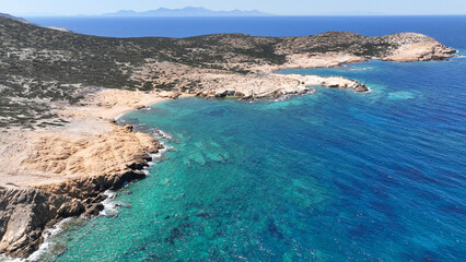 Fototapeta premium Aerial drone photo of beautiful nature and paradise secluded beaches of small island of Despotiko known for archaeological site untouched by tourism, Antiparos island, Cyclades, Greece