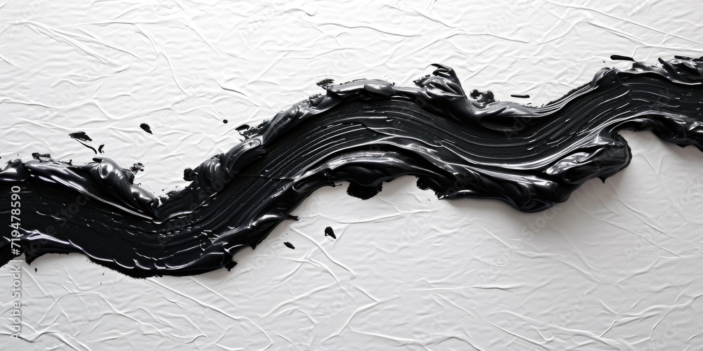 Poster Black paint is seen up close on a white surface. This image can be used for various design projects