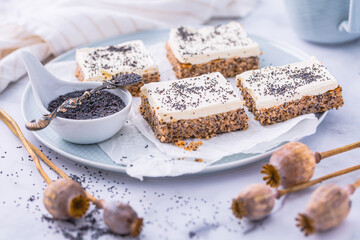 Homemade poppy seed cake with cream cheese icing