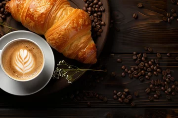 Cup of coffee with coffee bean, pastry, croissant on rustic wooden table background © krishnendu