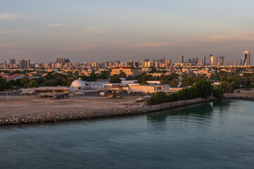 Naklejka premium Perspective of skyscraper towers and bay cityscape skyline of Abu Dhabi, sunrise in UAE.