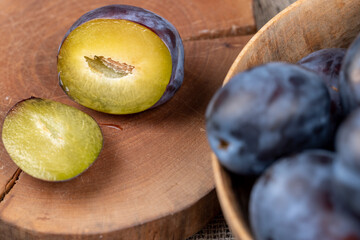 delicious fresh harvest plum oval shape and purple color