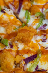 Fresh pizza with cheese and red onion with green pepper