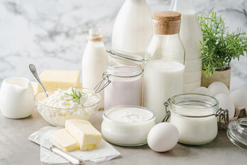 Fototapeta na wymiar Fresh dairy products, milk, cottage cheese, eggs, yogurt, sour cream and butter on kitchen table