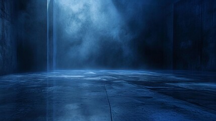 A large, shadowy chamber, its concrete floor reflecting faint light, as a deep indigo fog wafts against a navy blue background.