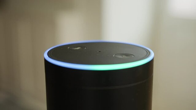 Close up of smart speaker activating after being spoken to